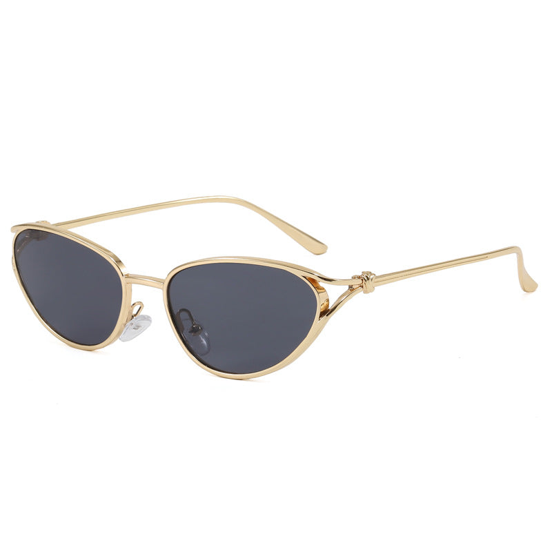 Glamorous women's cat-eye sunglasses, chic metallic frame, adding an elegant touch to summer wear.