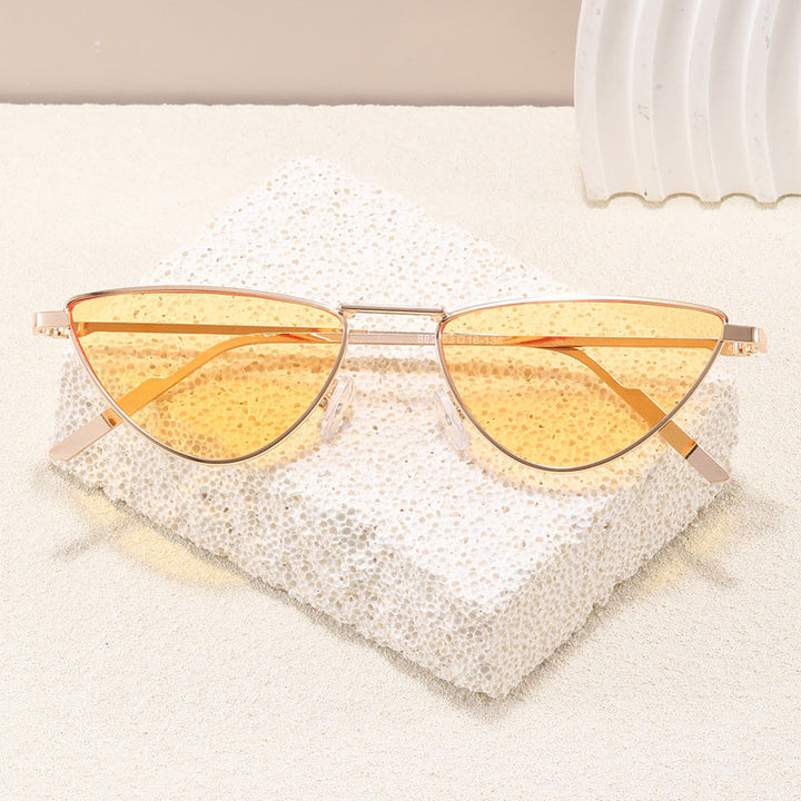 Sleek cat-eye sunglasses, a stylish women's accessory with UV400 protection for elegant summer eyewear.