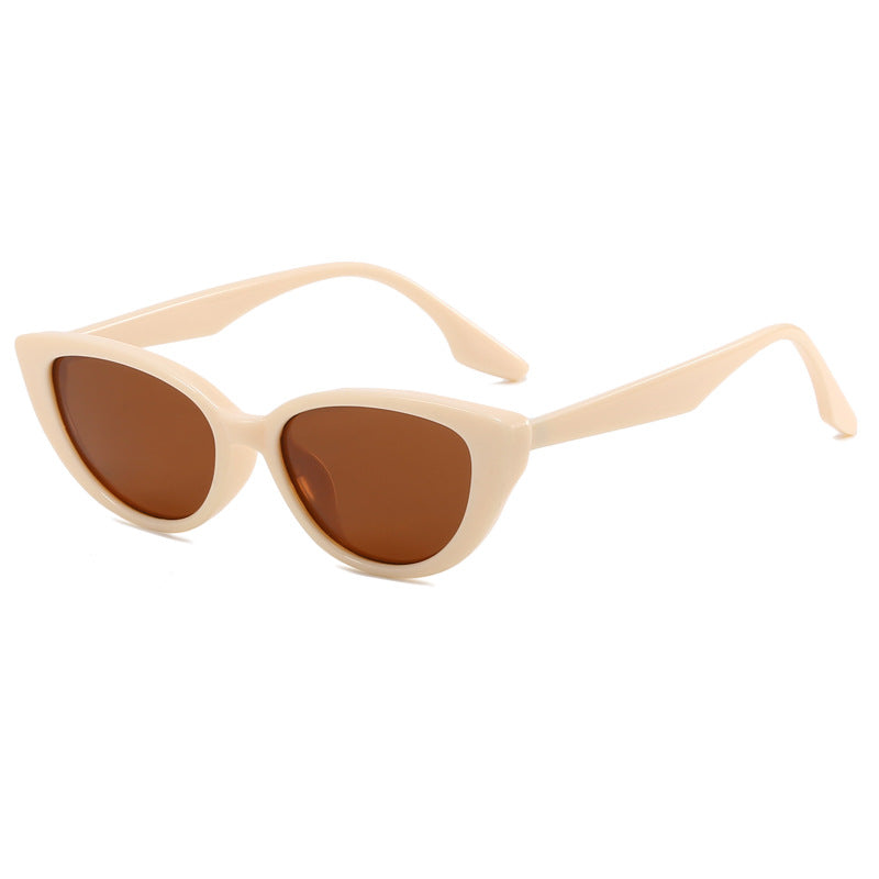 Close-up of women's chic cat-eye sunglasses, showcasing UV protective lenses and sleek frame.