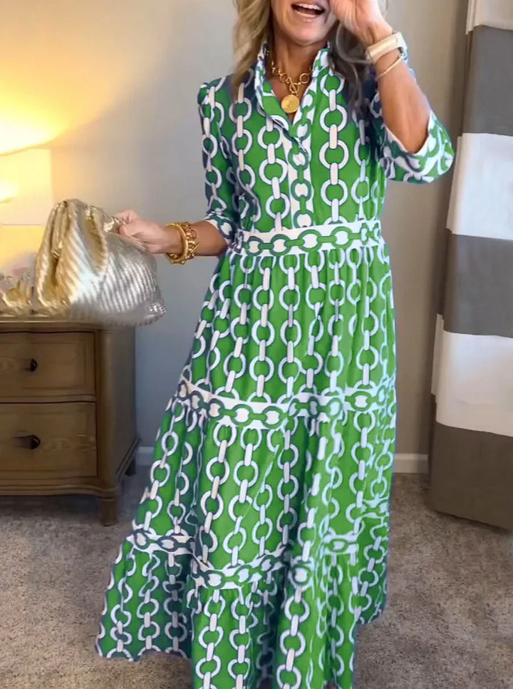 Elegant women's day dress featuring a unique chain print. Flowing maxi style for sophisticated summer fashion.