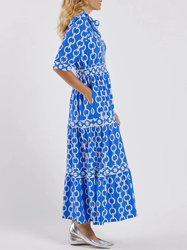 Sophisticated women's chain-print maxi dress, a versatile daywear option. Elegant and chic summer fashion.