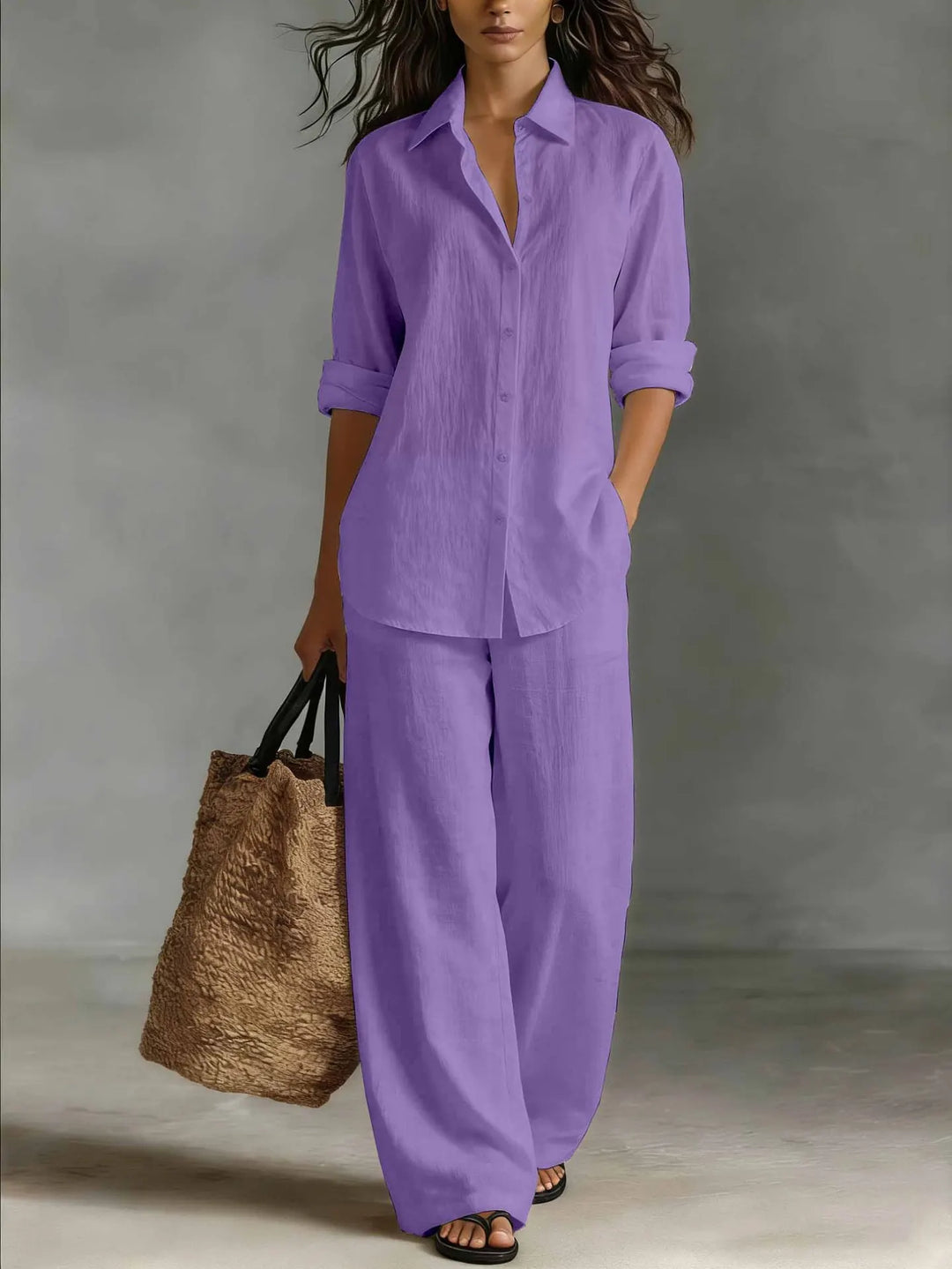 Relaxed fit women's two-piece set featuring a long-sleeve collared shirt & comfortable wide-leg pants.