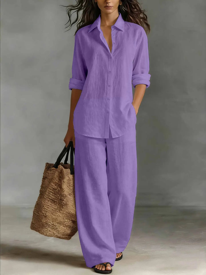 Relaxed fit women's two-piece set featuring a long-sleeve collared shirt & comfortable wide-leg pants.
