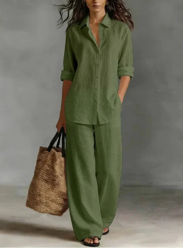 Model wearing a stylish women's collared button-up shirt & wide-leg pants two-piece set.