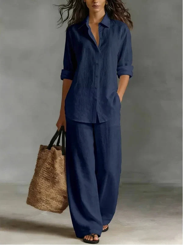 Stylish women's long-sleeve collared shirt and wide-leg pants set for a modern casual look.