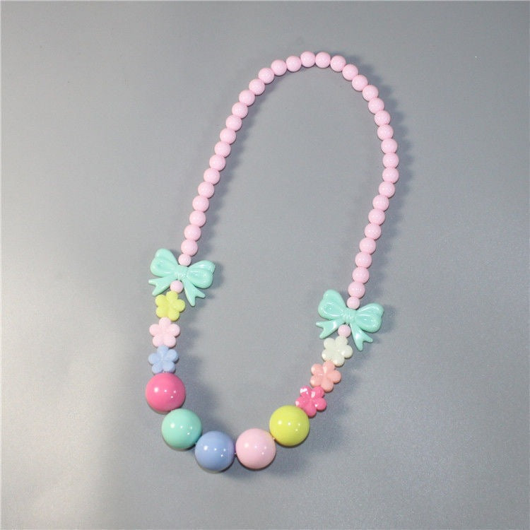 Women's chic colorful pearl floral necklace; elegant pastel beaded fashion jewelry.