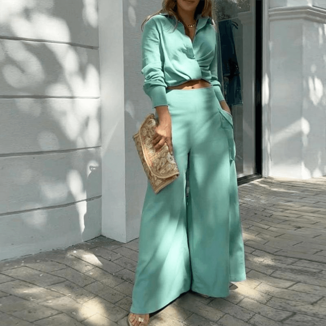 Comfortable women's two-piece set featuring a stylish crop top and flowing wide-leg trousers for spring.