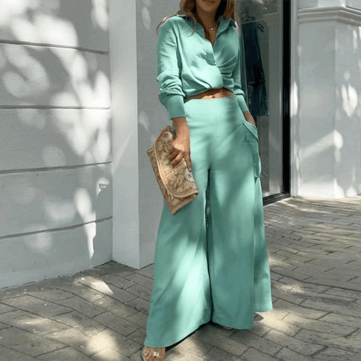 Comfortable women's two-piece set featuring a stylish crop top and flowing wide-leg trousers for spring.