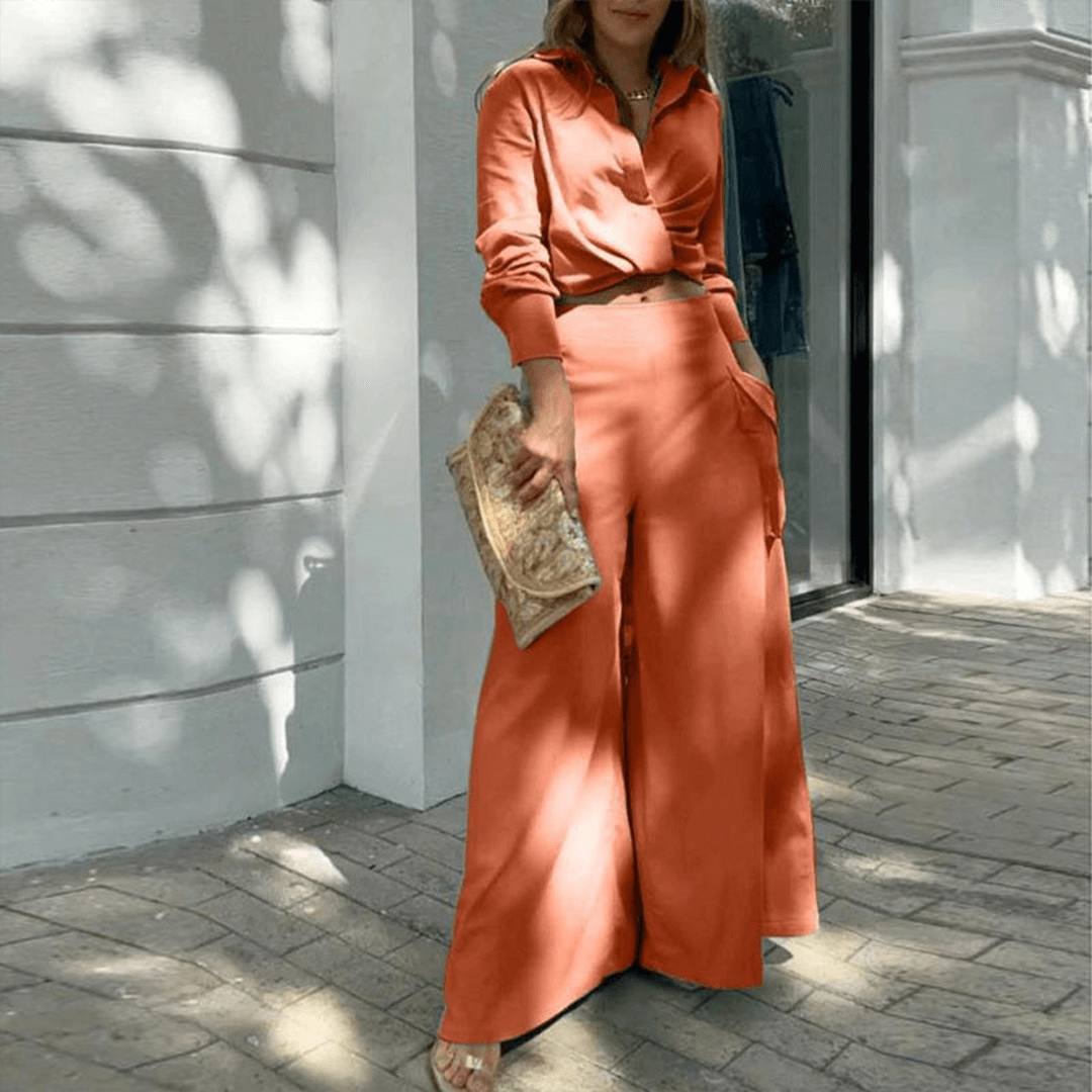 Versatile women's fashion set with a trendy crop top and elegant wide-leg trousers. Ideal for casual or chic wear.