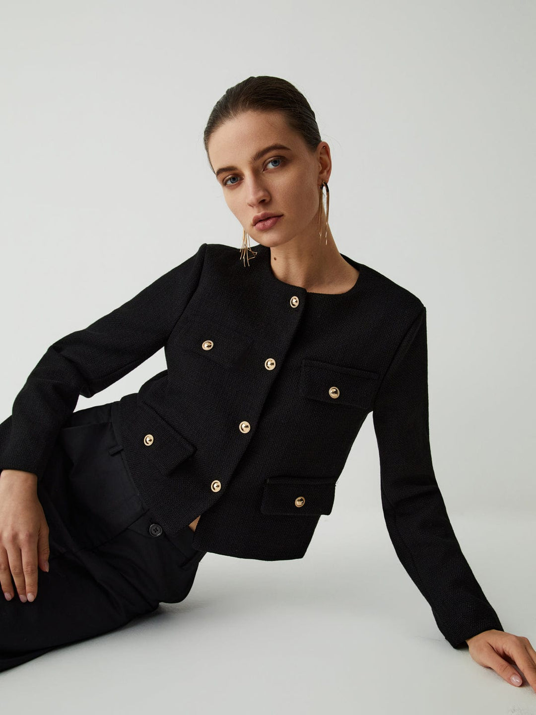 Versatile women's cropped jacket with gold buttons & pockets, great for fall, winter, and business.