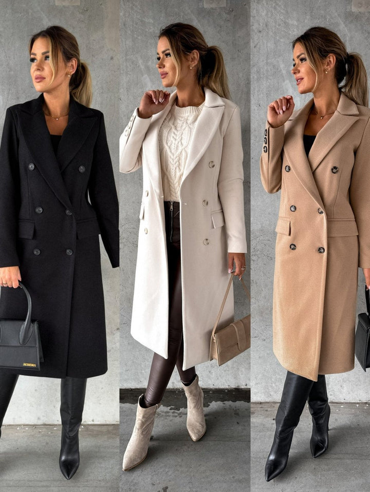 Front view of women's double-breasted winter coat. Stylish outerwear with a classic elegant cut.