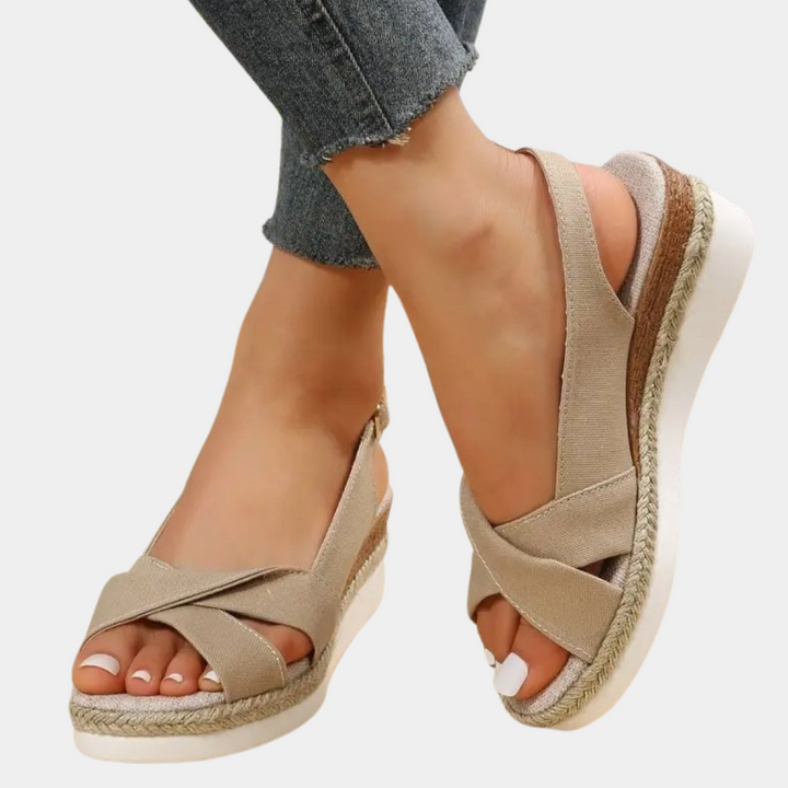 Comfortable women's espadrille flats with woven jute sole. Chic slip-on footwear for casual summer style.