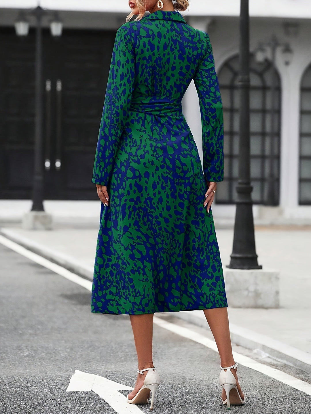 Front view: Women's geometric print belted midi shirt dress, stylish & vibrant.