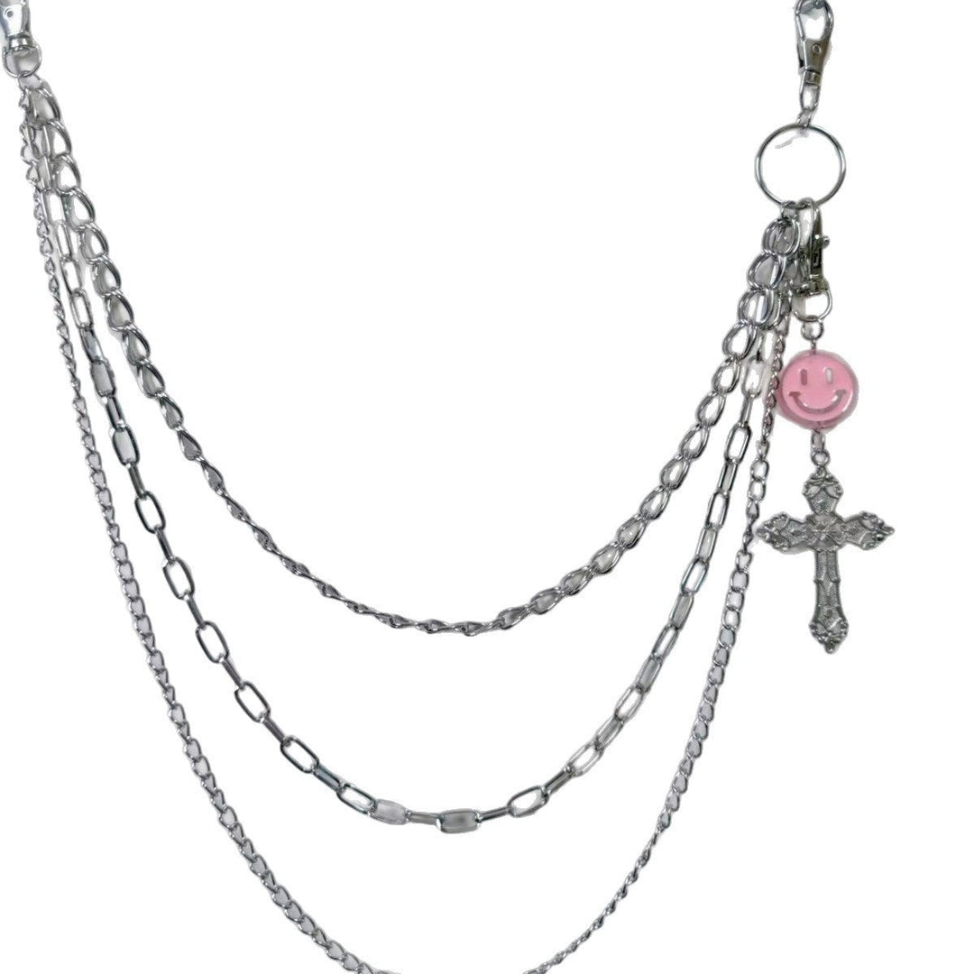 Trendy women's metal chain belt with elegant charm pendants, adjustable for dress waists, a chic fashion accessory.