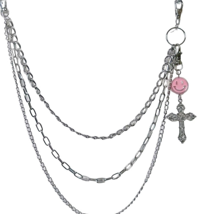 Trendy women's metal chain belt with elegant charm pendants, adjustable for dress waists, a chic fashion accessory.