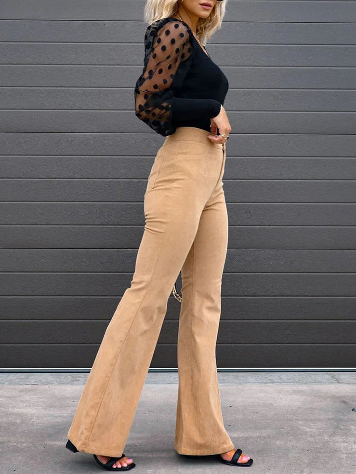 Model showcasing elegant women's high-waisted flare pants, ideal for a chic, trendy outfit.