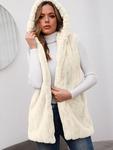 Cozy warm women's winter jacket with hood, combining chic style & practical outerwear for cold weather.