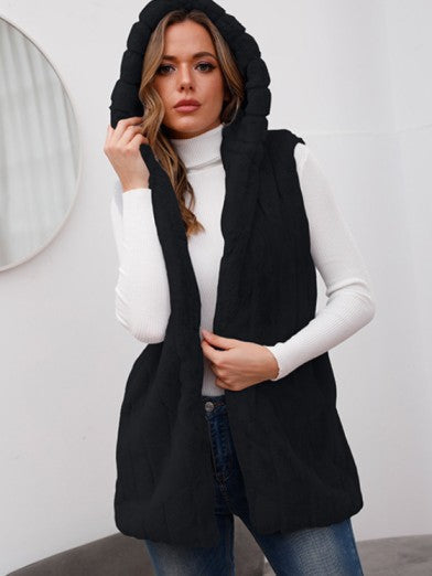 Trendy women's hooded winter jacket, providing chic warmth & cozy comfort for stylish cold-weather looks.