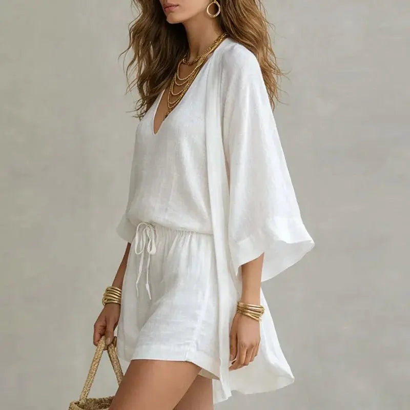 Relaxed fit women's linen co-ord set with V-neck top and drawstring shorts, ideal for beach or vacation wear.