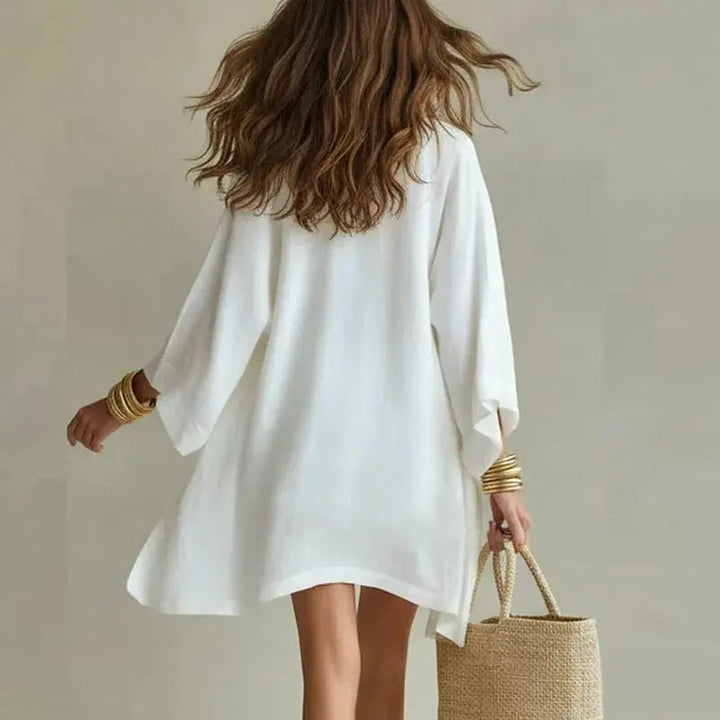 Stylish women's three-piece linen co-ord set featuring a V-neck top, comfy drawstring shorts, and matching jacket.