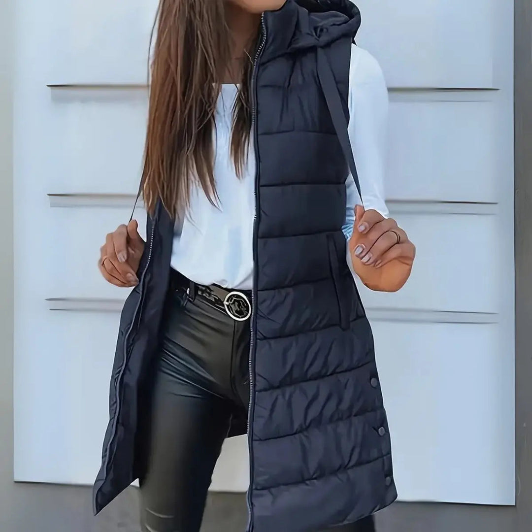 Versatile women's hooded longline puffer vest. Ideal lightweight sleeveless jacket for fall & winter fashion.