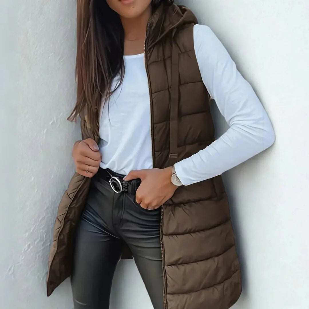 Chic women's longline hooded puffer vest. Lightweight & sleeveless, great for casual everyday style.