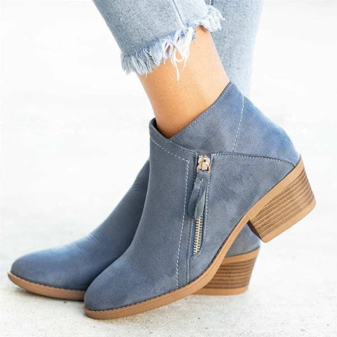 Women's chic low-heel ankle boots with side zip closure, perfect for everyday comfort and versatile autumn style.