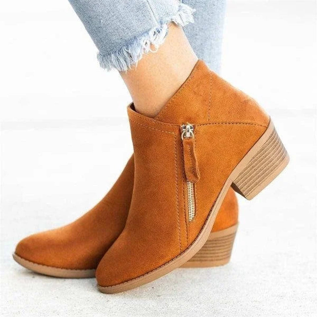 Chic women's autumn ankle boots with a sleek side zip and comfortable low heel, perfect for fashion-forward looks.