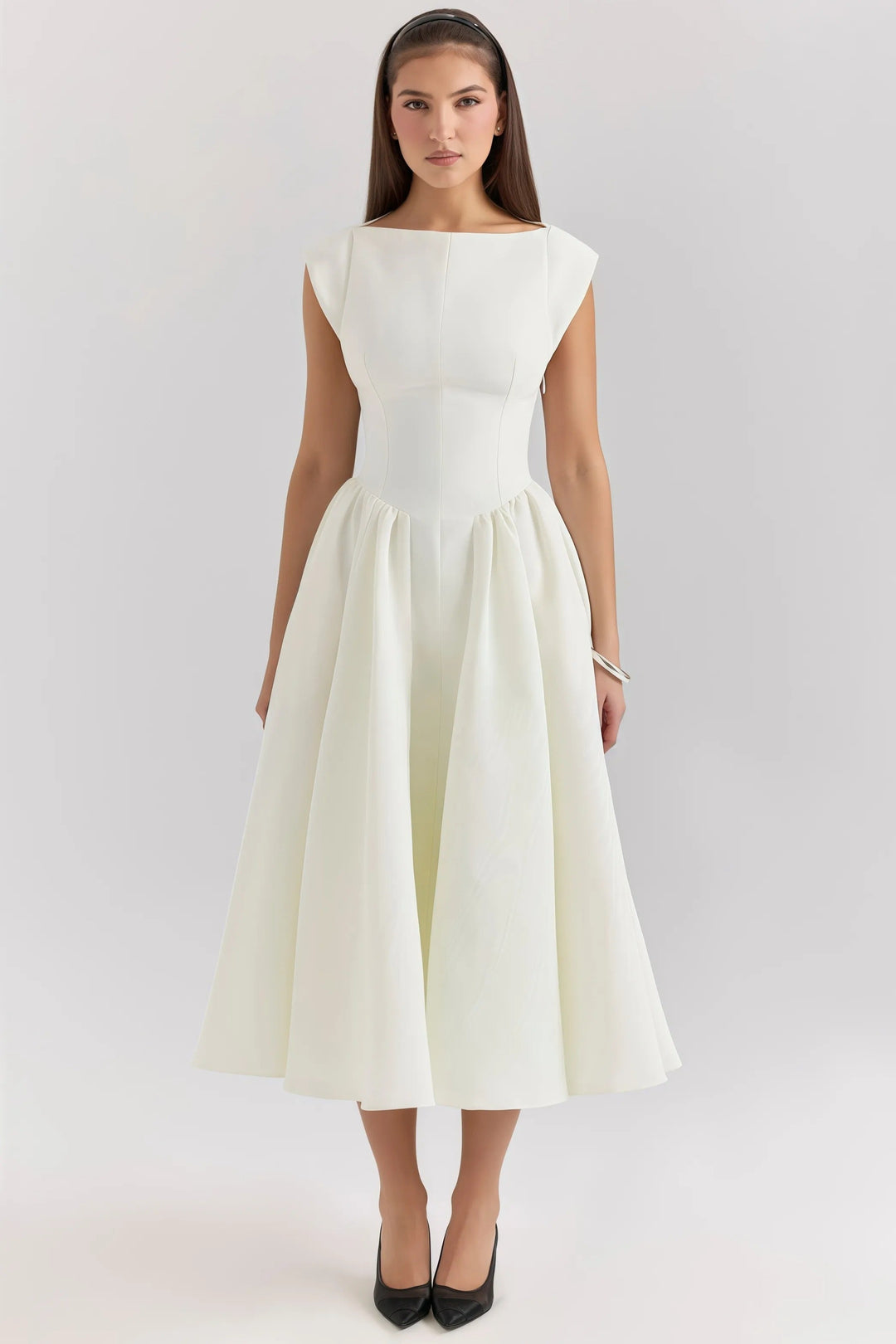 Elegant women's backless midi dress. Chic modern style with beautiful ruffles, ideal for summer occasions.
