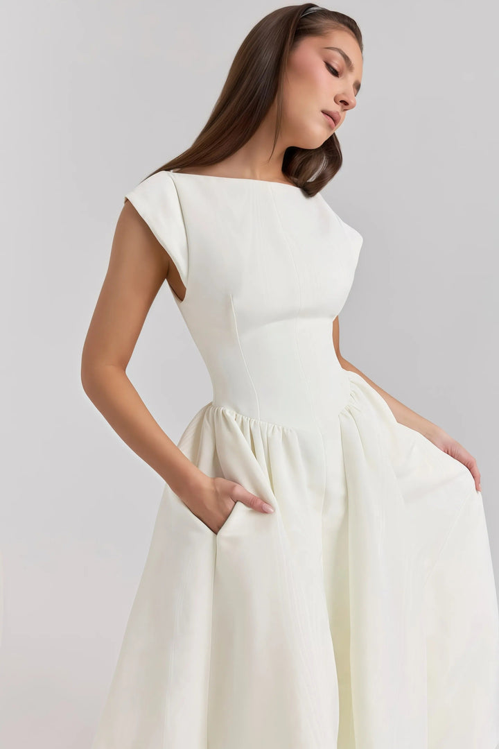Elegant backless women's midi dress. Chic ruffle detail, perfect for spring fashion & summer gatherings.