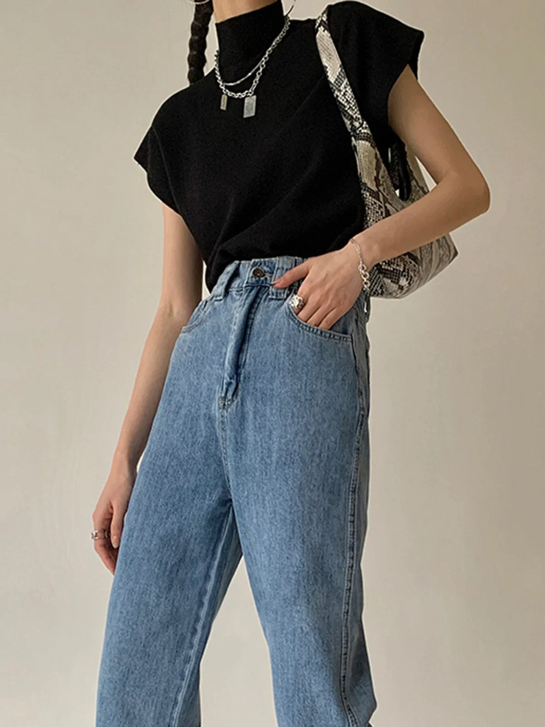Elegant women's top with mock neck, padded shoulders & cap-sleeves. Perfect for layering.