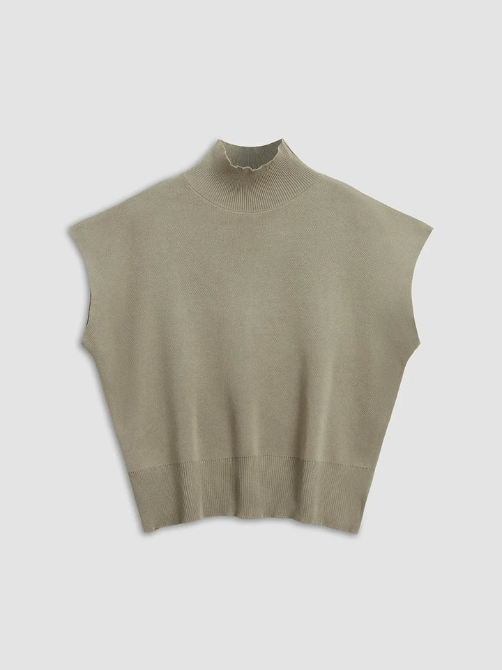 Sophisticated women's cap-sleeve top, mock-neck & padded shoulders. Chic for any occasion.