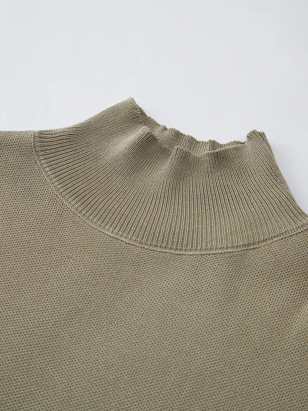 Elegant women's mock-neck top, padded shoulders, cap sleeves. Versatile for modern style.