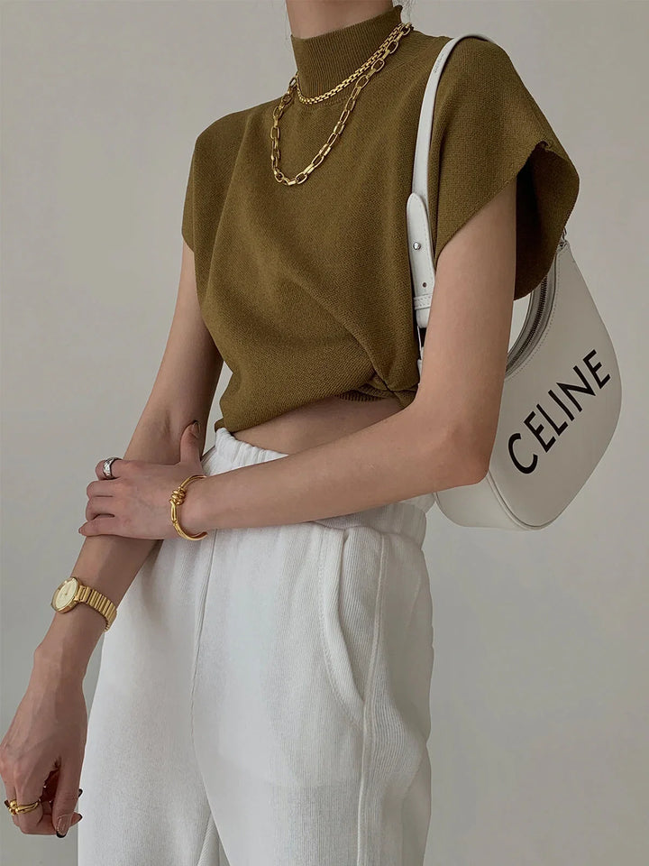 Women's fashionable mock-neck sweater, padded shoulders, cap sleeves. Modern & elegant.