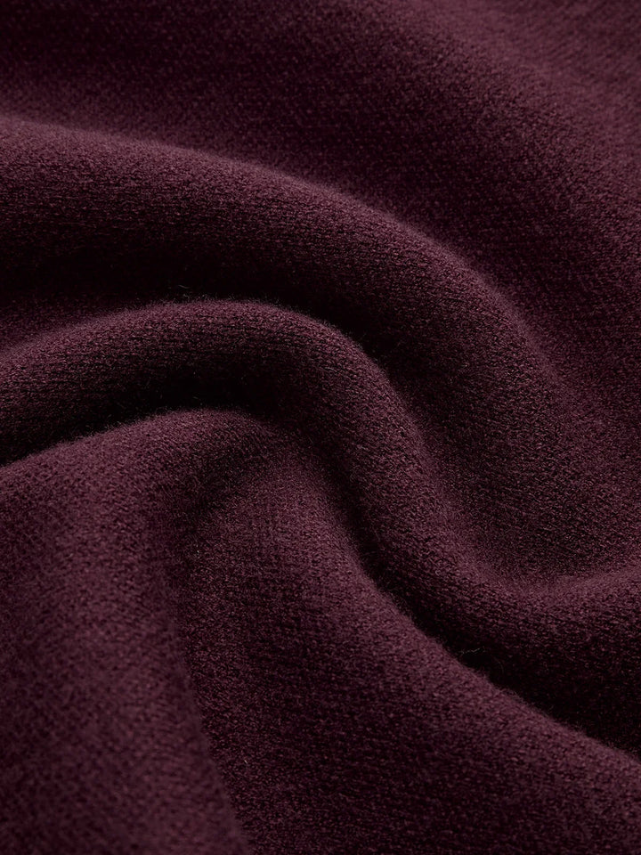 Modern women's mock-neck sweater, cap sleeves & padded shoulders. Chic & versatile fashion.