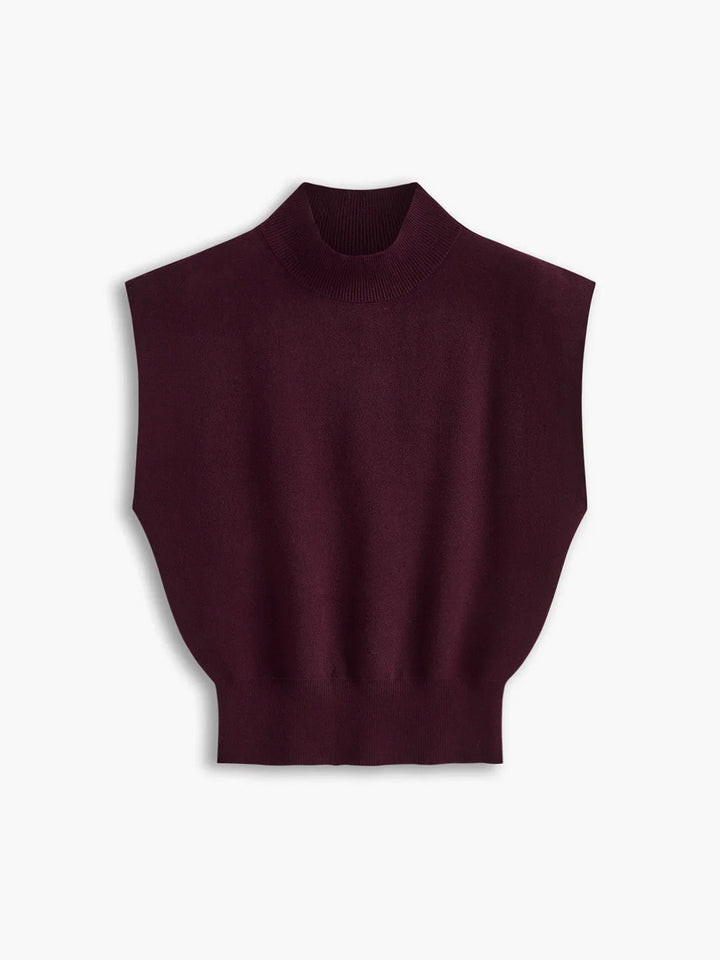 Versatile women's mock-neck top with padded shoulders & cap sleeves. A modern staple.