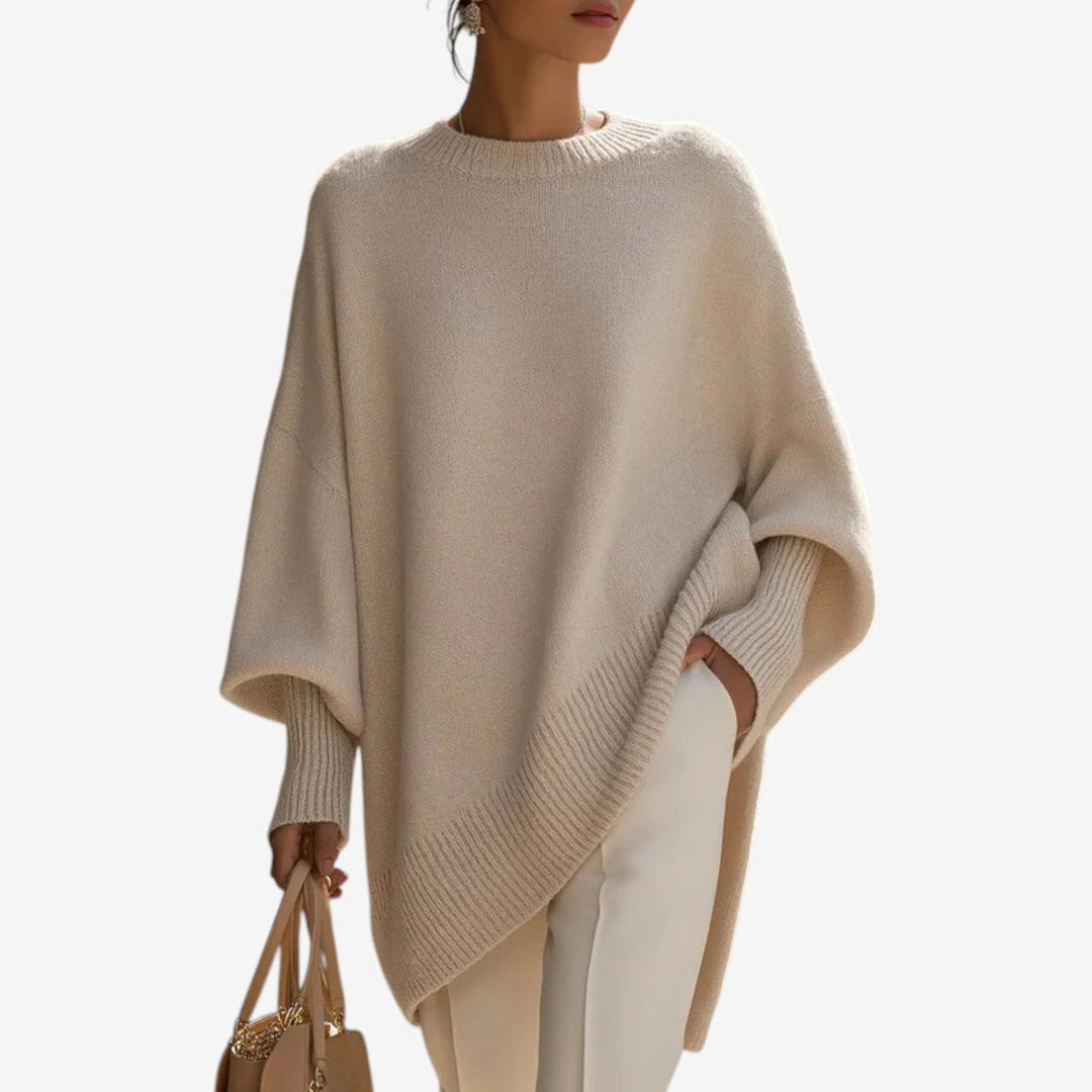 Women's chic oversized batwing sleeve sweater with asymmetric hem, perfect for casual autumn fashion.