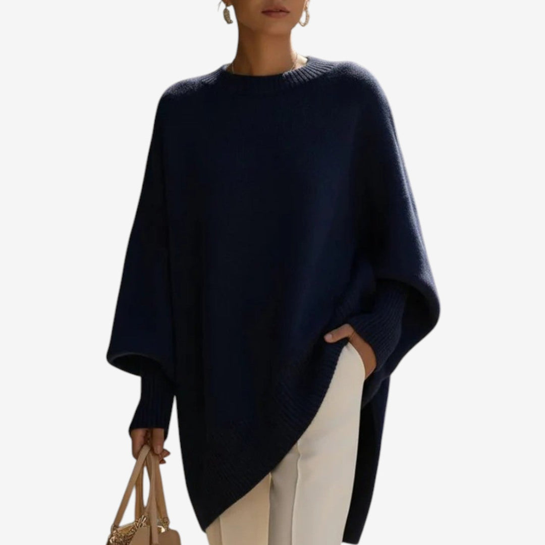 Stylish women's batwing sleeve sweater, oversized with an eye-catching asymmetric hem, chic for winter fashion.
