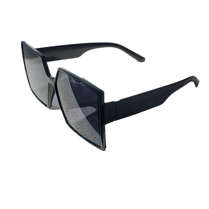 Stylish women's oversized sunglasses, black lens, trendy accessory for elegant eye protection.