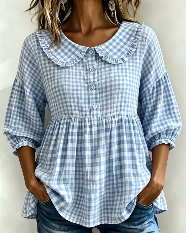 Stylish women's long sleeve plaid blouse featuring a charming Peter Pan collar and fashionable lantern sleeves.