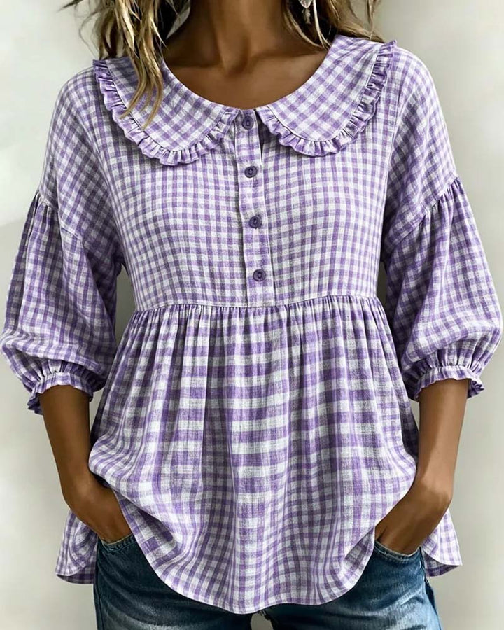 Retro-inspired women's plaid top with a cute Peter Pan collar & voluminous lantern sleeves. Chic & casual fashion.