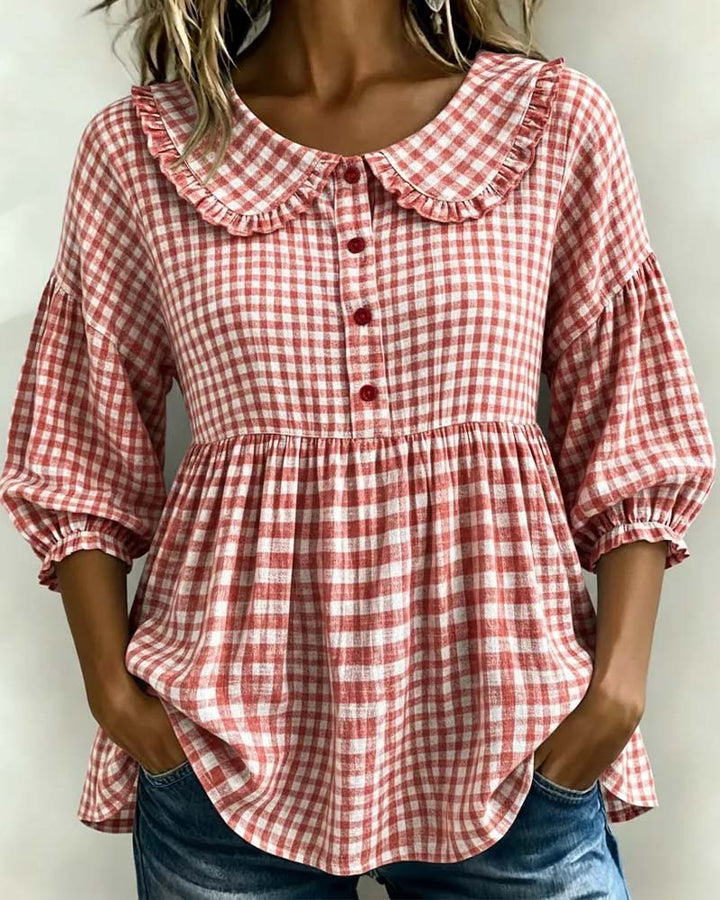 Women's chic plaid blouse featuring a stylish Peter Pan collar and fashionable lantern sleeves, perfect for elegant wear.