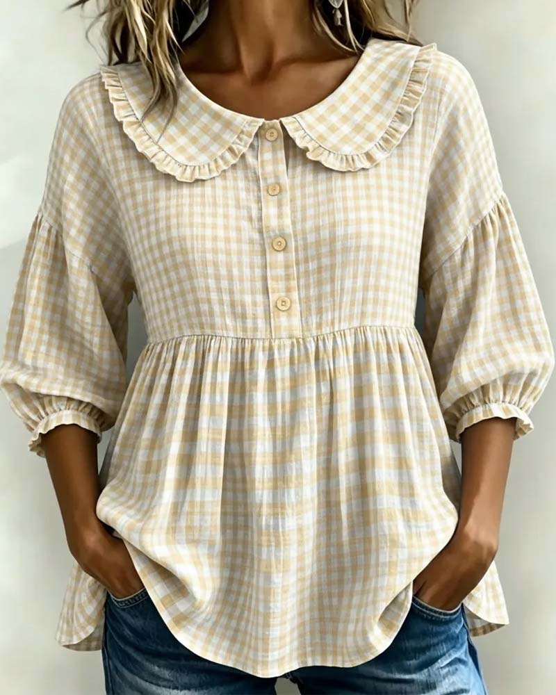 Casual yet elegant women's plaid blouse with a distinctive Peter Pan collar and trendy lantern sleeves. Retro style.