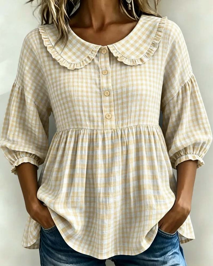 Casual yet elegant women's plaid blouse with a distinctive Peter Pan collar and trendy lantern sleeves. Retro style.