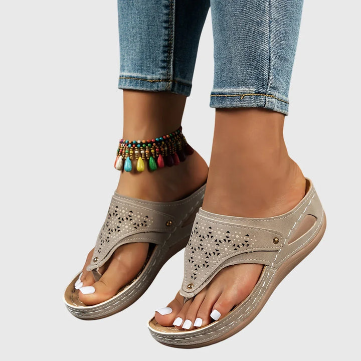 Comfortable women's platform slip-on sandals with elevated sole & ankle strap for summer.