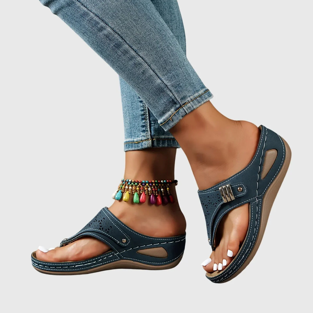 Chic women's slip-on platform sandals with modern cut-out detail & comfortable elevated sole.