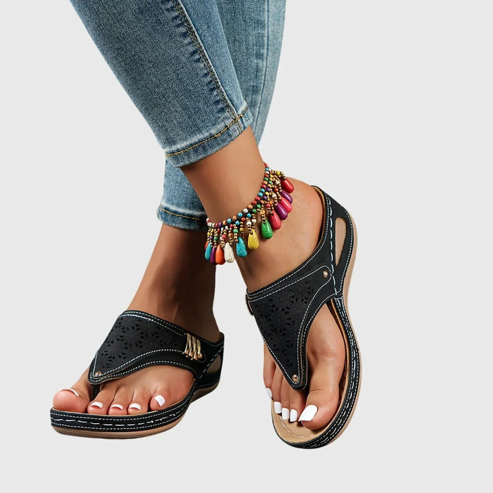 Elevated comfort women's platform slip-on sandals with stylish cut-out detail and ankle strap.