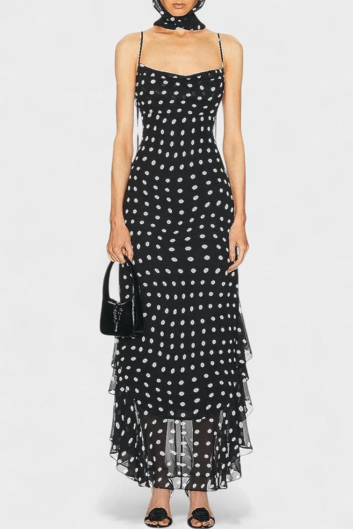 Women's chic polka dot dress with adjustable straps, perfect for versatile summer fashion and elegant occasions.