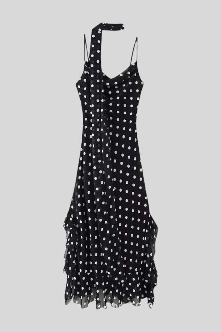 Elegant women's polka dot dress, a romantic choice for parties, day wear, or stylish evening events.