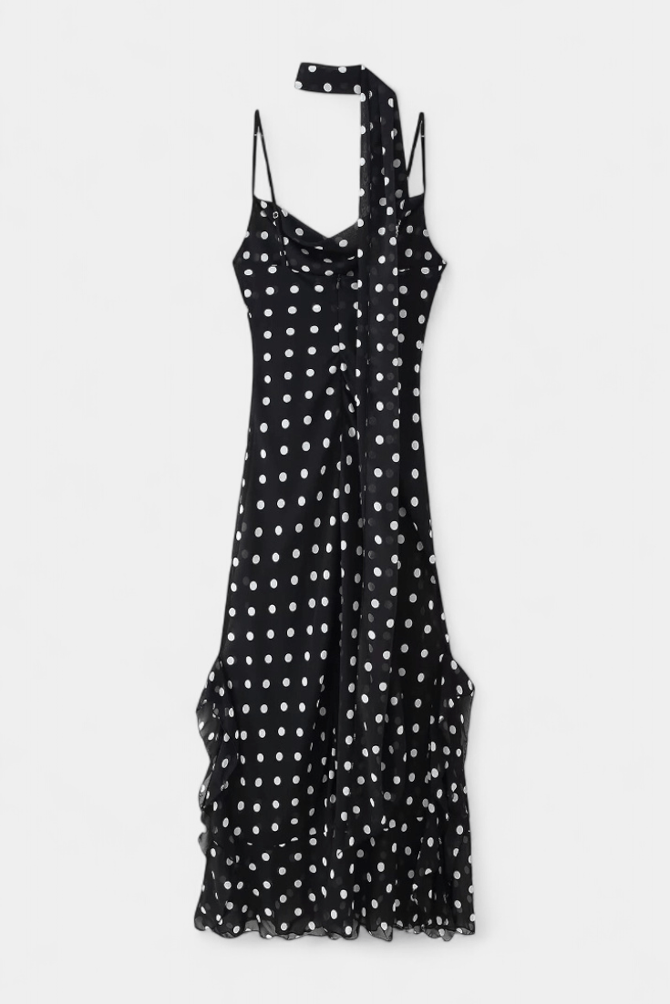 Stylish women's polka dot summer dress with adjustable straps, perfect for a romantic day or evening out.